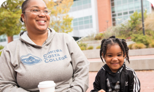 Black woman with her child smiling