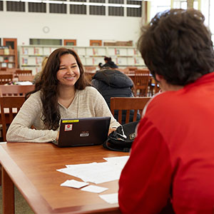 Two students sitting at the library