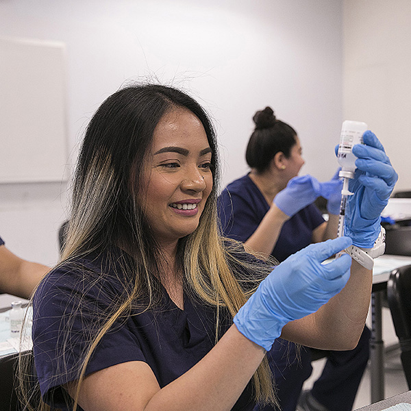 Female identifying medical assistant student